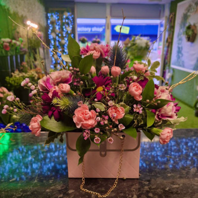 Country Charm - A rustic-inspired floral arrangement, featuring soft pink and white blooms, carefully placed in a vintage-style watering can. Perfect for adding a touch of nature’s beauty indoors.